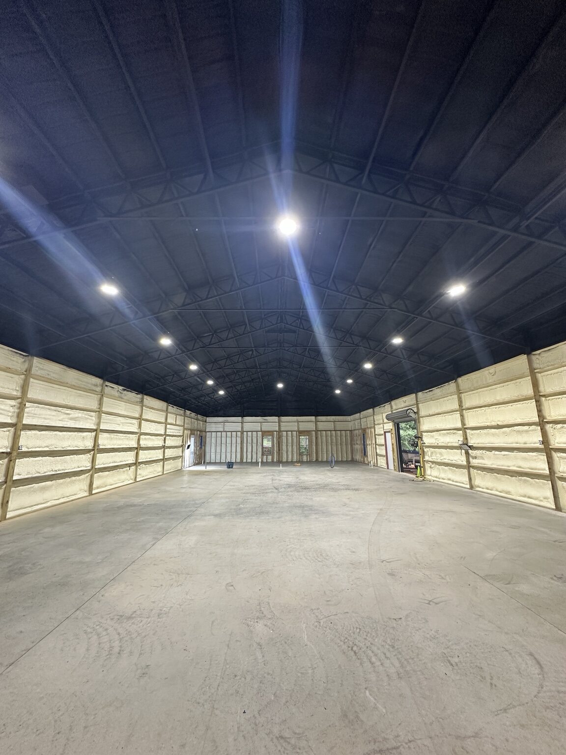 Finished metal-building interior insulated by Castle Foam